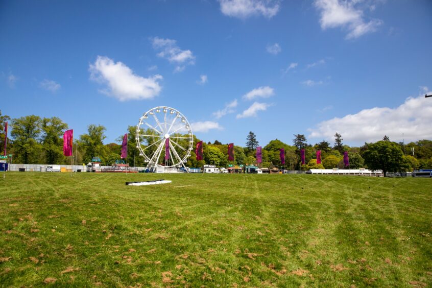 The audience area for the Main stage with a ferris wheel.