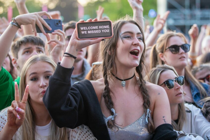 A fan holds up a sign for The 1975. Image: Kim Cessford/ DC Thomson