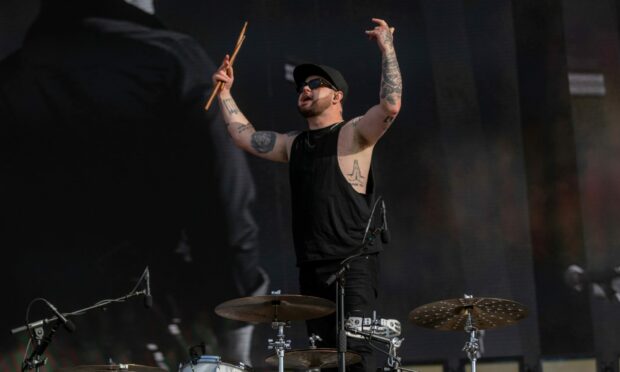 Royal Blood drummer Ben Thatcher tries to gee up the Big Weekend crowd. Image: Kim Cessford/DC Thomson