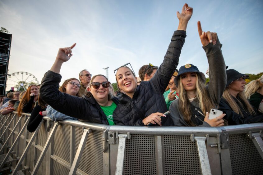 Fans on the front row for Lewis Capaldi pose for our photographer during his set.