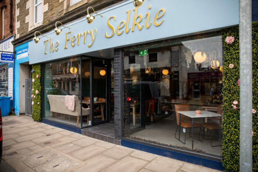 The outside of 335 Brook Street, Broughty Ferry, a restaurant with large windows and a sign saying The Ferry Selkie on a blue background.