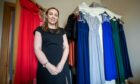 Jodie Ewen with prom dresses in her home.