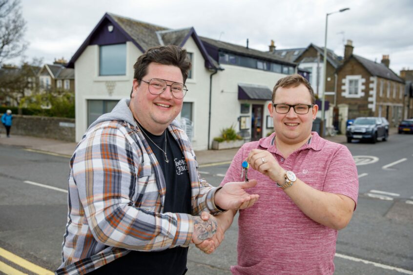 Chef Jamie Scott collecting keys from fellow chef Adam Newth outside the Sandbanks Brasserie, formerly known as the Tayberry, on Broughty Ferry Esplanade.
