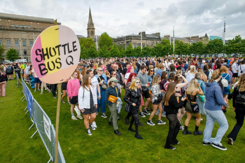 Fans queueing for Big Weekend shuttle buses in Dundee city centre