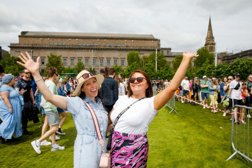 Smiling festival-goers.