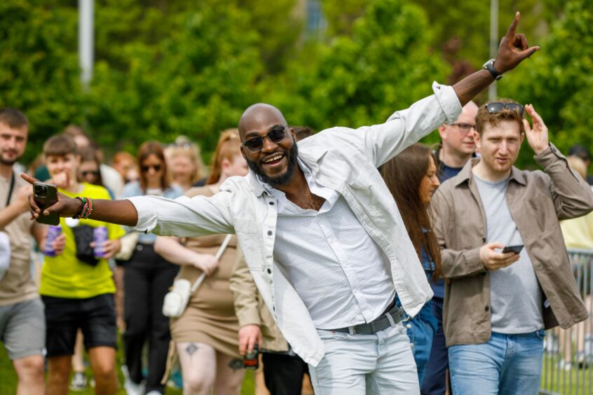 Man striking a pose for cameras at Slessor Gardens.