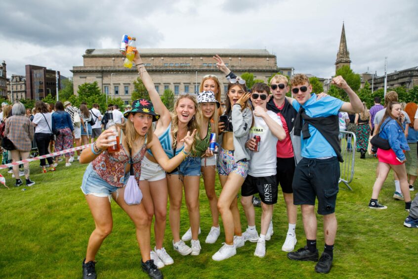 Group of friends posing for photos.