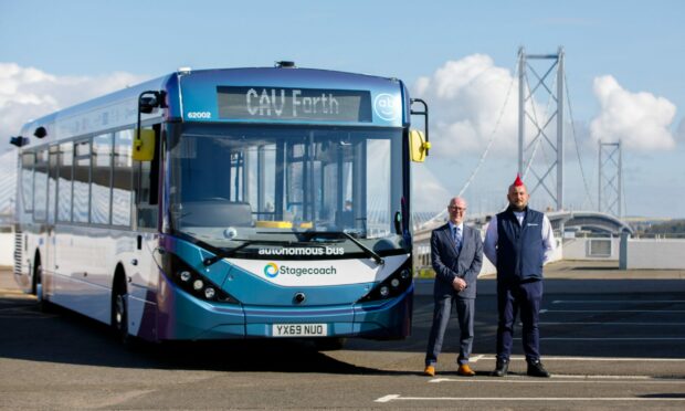 Scottish Transport Minister Kevin Stewart Minister for Transport is joined by one of the bus operators/drivers Stuart Doidge in South Queensferry. Image: Kenny Smith/DC Thomson