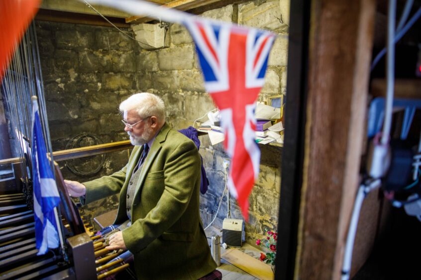 Callum MacLeod plays the carillon bells to mark the King's Coronation in St Andrews.