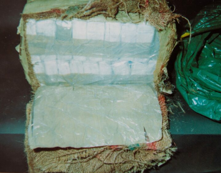 This is the moment forensic officers discovered the drugs imported by Mr X's gang was not cannabis but cocaine. This is a picture of one of the bales cut open. Image: Crown Office.
