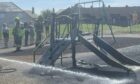 Firefighters tackling the blaze at the Kirkton playpark.