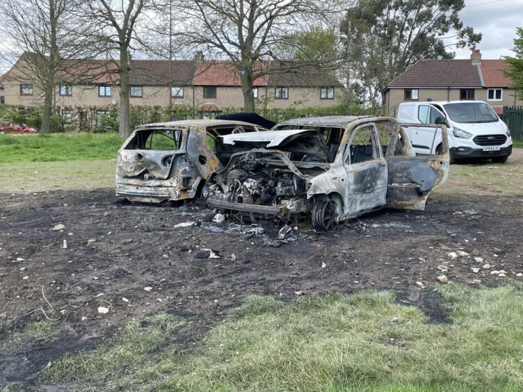 The remains of fire-damaged cars in Caird Park, Dundee