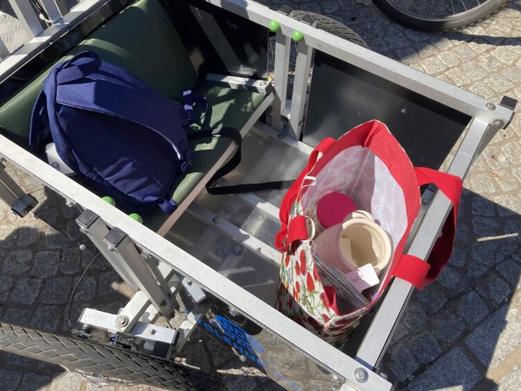 Joanna's shopping in her e-cargo bike. A pot of body scrub, tanning foam plus mitt, and a ceramic jug. Did they survive a shopping trip through Dundee's Low Emission Zone on the e-bike? 