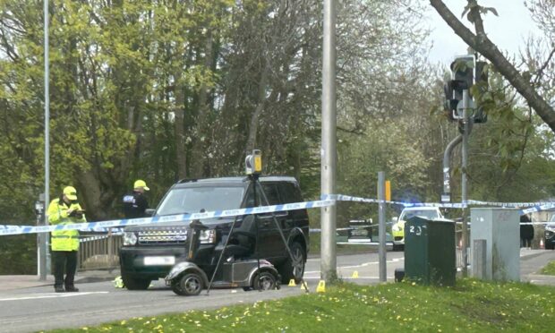 A car and mobility scooter on Woodside Way in Glenrothes after suspected collision. Image: Neil Henderson