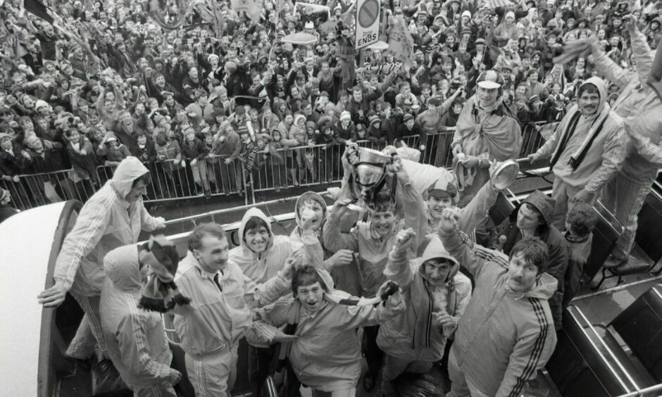 Drunk on success: United's league heroes parade the 1983 League Championship trophy. Image: DC Thomson.