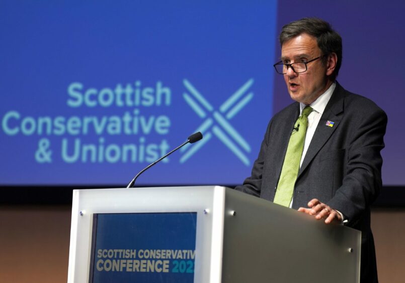 Grag Hands at a lectern in front of a Scottish Conservative and Unionist party logo