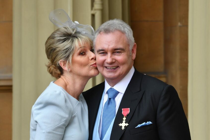 Eamonn Holmes is kissed by his wife Ruth Langsford, after he was awarded the OBE.