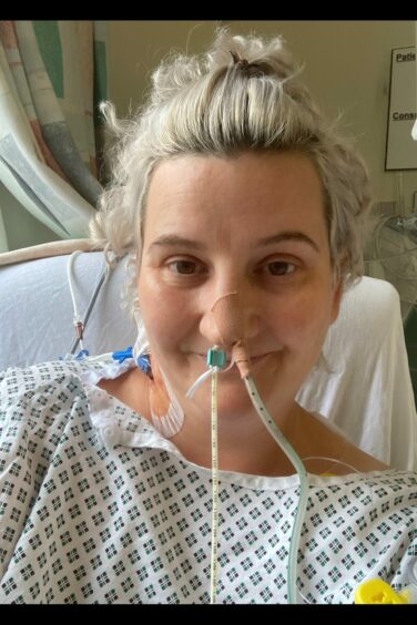Rachel Ferguson is pictured in hospital being tube-fed after the operation to remove part of her liver.