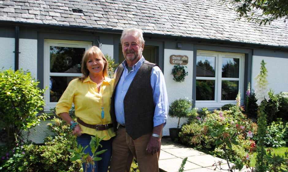 Laura and David Gill outside Daisy Cottage in Dunblane cottage, which features in Scotland's Home of the Year. Image: BBC Scotland.