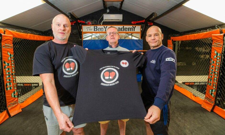 Craig Donald, Scott Rae and David Soutar with an anti-knives t-shirt