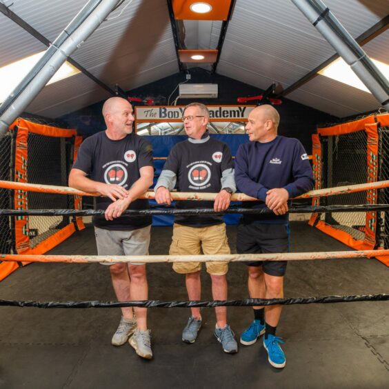 Craig Donald, Scott Rae and David Soutar standing in a boxing ring