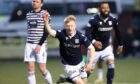 Dundee's Lyall Cameron celebrates scoring against Queen's Park as Dundee win the league.