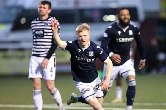 Dundee's Lyall Cameron celebrates scoring against Queen's Park as Dundee win the league.