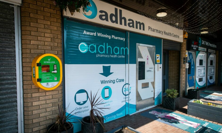 Anyone can use the defibrillator, which is on the wall outside Cadham Pharmacy. 