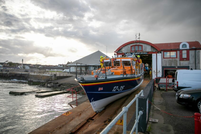 Arbroath lifeboat Inchcape launches from the station slipway.