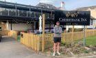 Scott Findlay, arms folded outside Cherrybank Inn