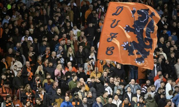 Dundee United supporters display a flag at Tannadice