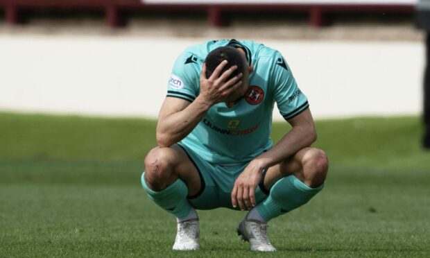A dejected Aziz Behich following relegation. Image: SNS