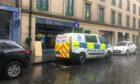 Police outside The Selkie on Exchange Street. Image: James Simpson/DC Thomson