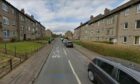 Image shows a street view of St Columba Gardens, Dundee.