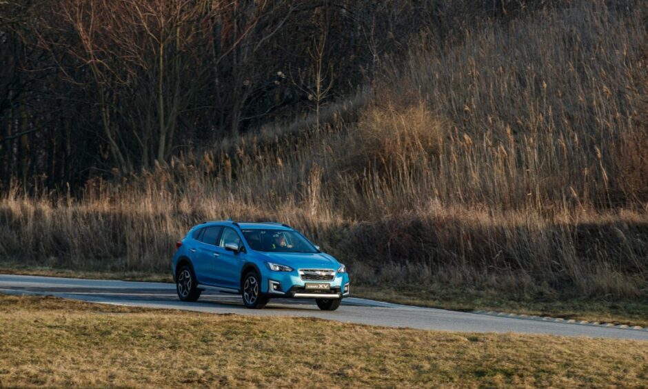 Exploring in the Subaru XV. The car on a country road in the distance. Image: Subaru.
