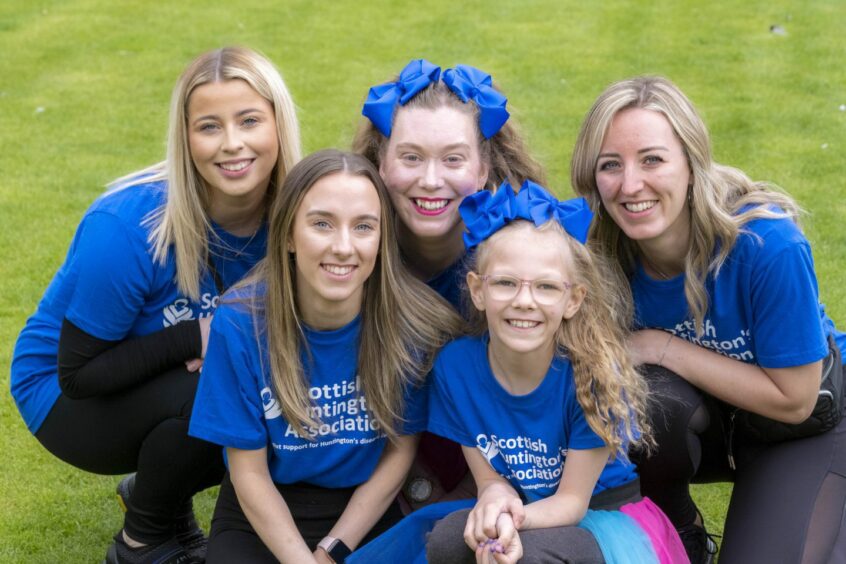 Fife woman Suzanne Armit attended a fundraiser in Glasgow to raise awareness of Huntington's disease in memory of her dad. She is pictured with friends and family at the event. Image: Peter Devlin.