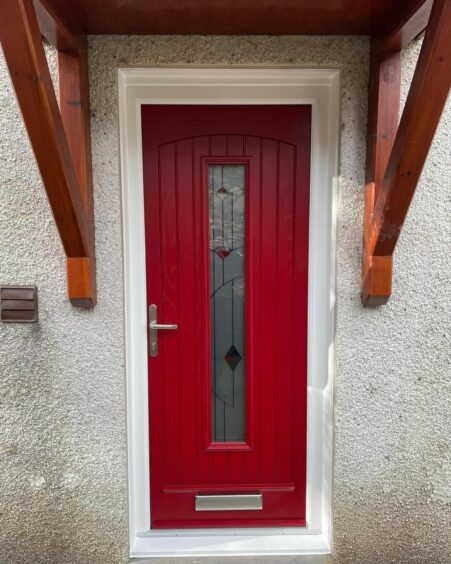 A photo of a red front door