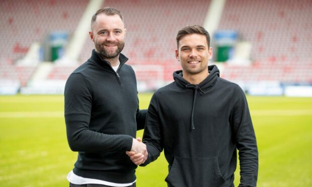 James McPake with Aaron Comrie after the defender signed a new deal. Image: Craig Brown