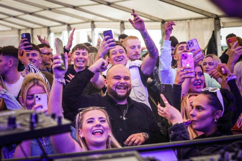 The crowds were loving life in the outdoor DDE main tent. 