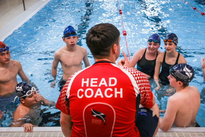 Gabriella (back right) is part of the swimming school.