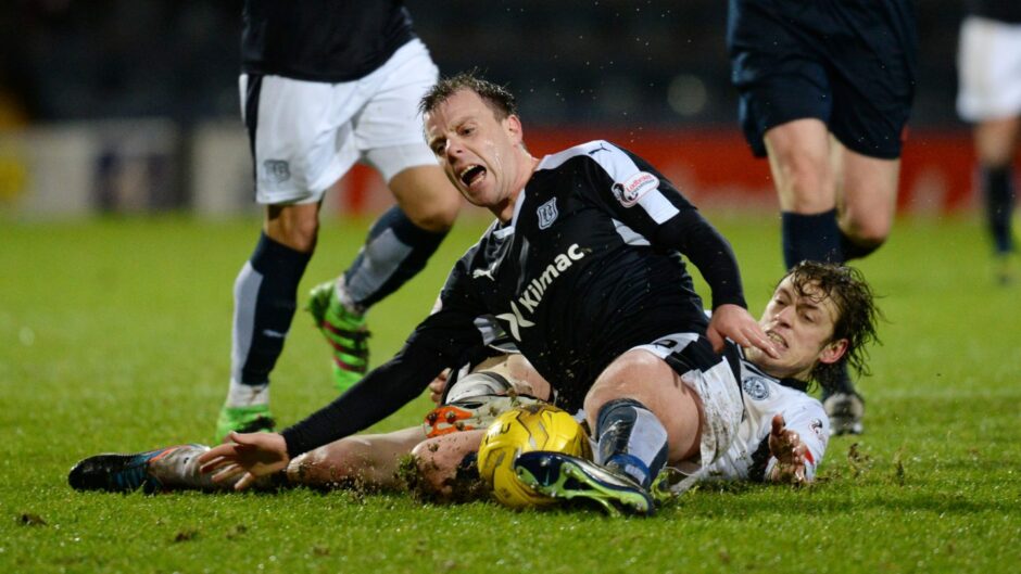 Saints fans loved to see Davidson getting the better a Dundee opponent and Paul McGowan didn't seem to enjoy this trademark tackle. 