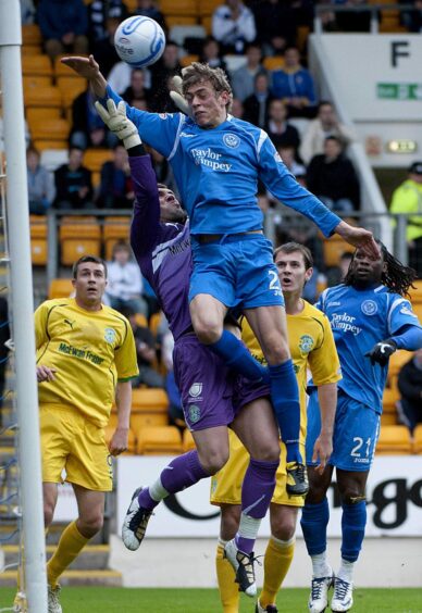 Even in a crowded box of strikers and centre-halves, Davidson was often the player who got up highest as in this 2010 match against Hibs. 