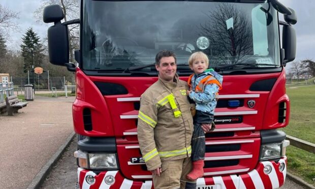 Piotr Gudan and his four-year-old son Dominic. Image: SFRS.