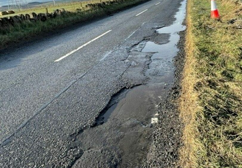 The damaged stretch of road. I