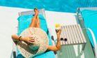 Lesley loves her work - all the same, she's dying for a poolside pina colada! Image: Shutterstock.