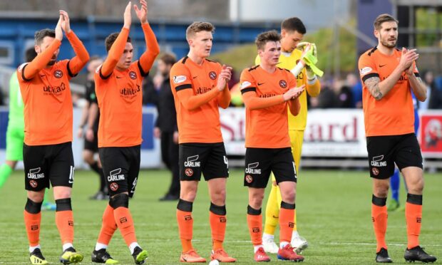 Dundee United's Paul Watson, Jamie Robson and Frederic Frans applaud the fans at full time
