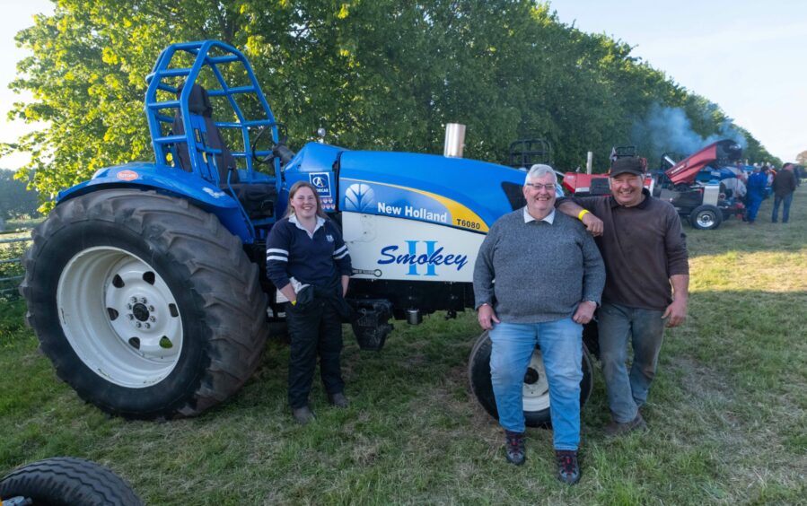 Wattie Mitchell tries tractor pulling for 70th birthday. Here he is pictured with nephew Ewan Cameron (right) and Ewan's daughter Mhairi. 