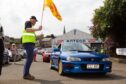 Thumbs up for a rare Subaru 22B heading away from the Forfar start line. Image: Paul Reid
