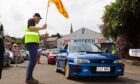 Thumbs up for a rare Subaru 22B heading away from the Forfar start line. Image: Paul Reid