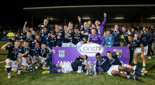 Dundee celebrate after winning the Championship. Image: SNS.